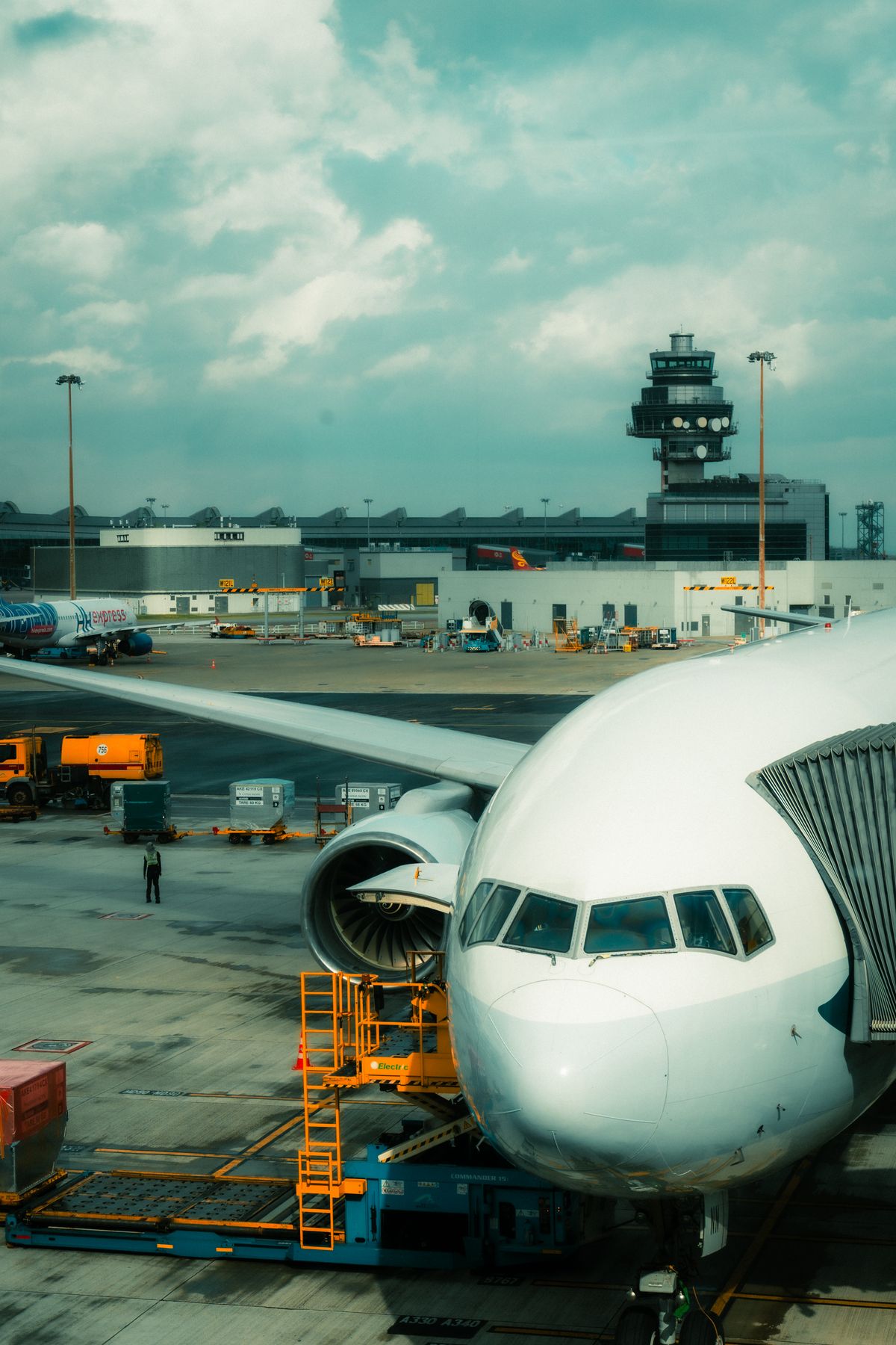 A commercial airplane parked at an airport terminal